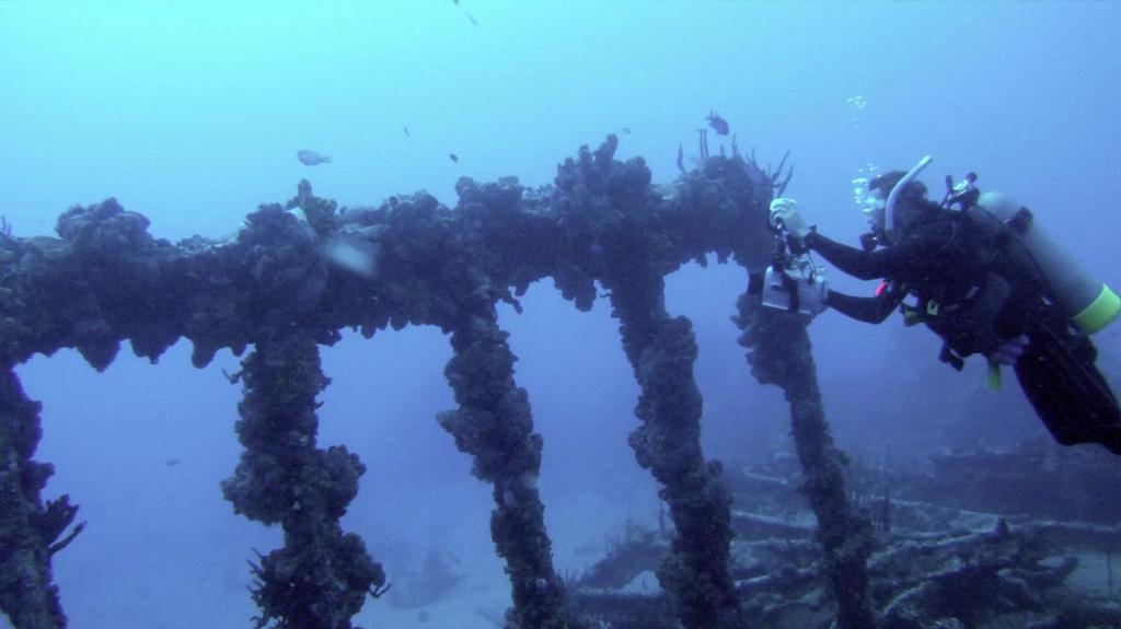 Paul Shard filming on the wreck of The Rhone in the British Virgin Islands (BVI). Working but earning at home. - ``Making Money while Cruising`` by Sheryl Shard. Photos by Paul and Sheryl Shard photo copyright Sheryl Shard taken at  and featuring the  class