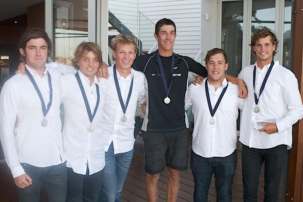 Sam Gilmour and his team accept their medallions. photo copyright Bernie Kaaks taken at  and featuring the  class