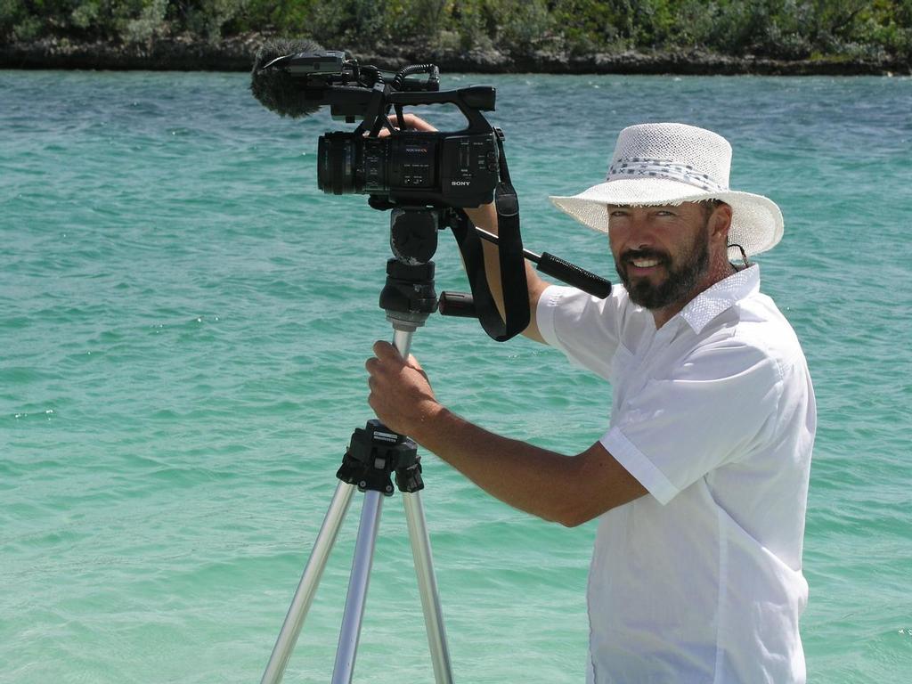 Paul Shard with camera (portrait) in the Bahamas filming for the Distant Shores sailing TV series © Sheryl Shard
