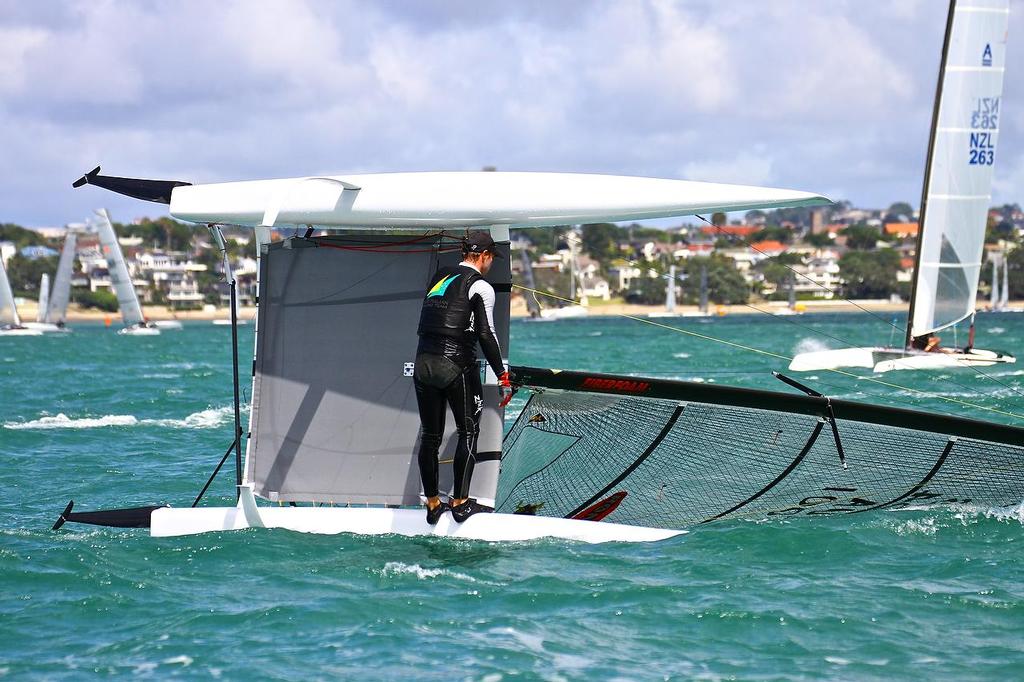 Nathan Outteridge (AUS) capsized just before the finish of Race 1, showing the foil package. A-class catamaran Nationals Takapuna February 8, 2014 photo copyright Richard Gladwell www.photosport.co.nz taken at  and featuring the  class