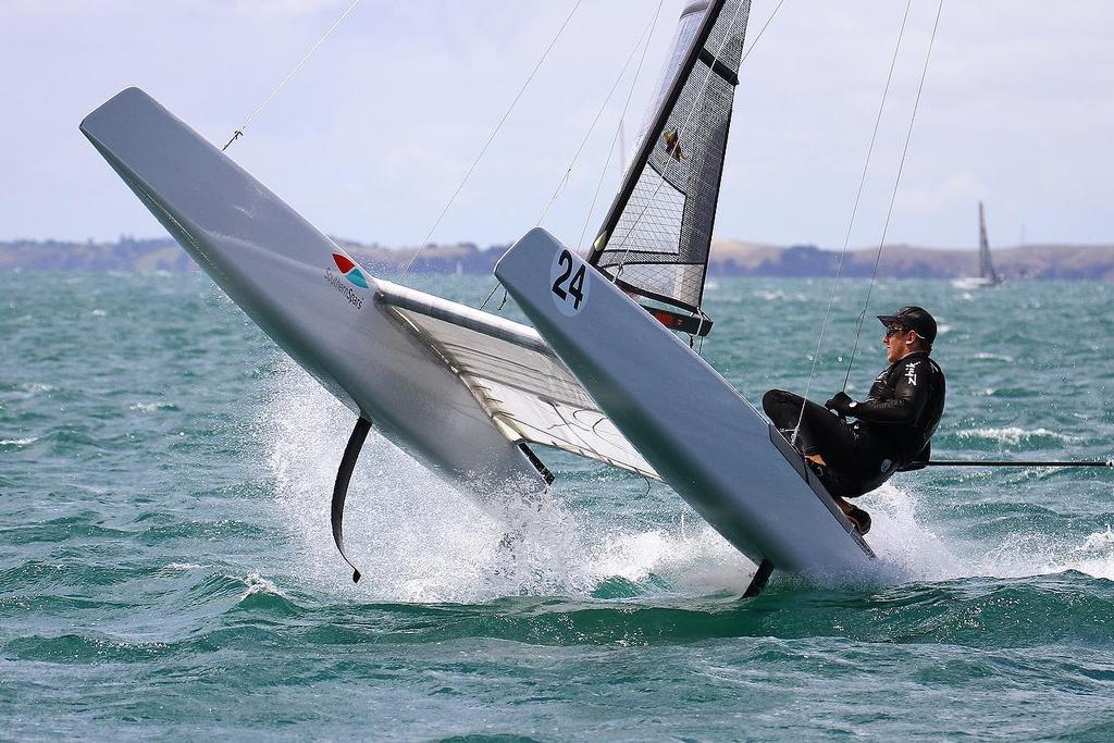 Peter Burling (NZL) roll tacking at the A-class catamaran World Championships, Day 3, Takapuna February 13, 2014 © Richard Gladwell www.photosport.co.nz