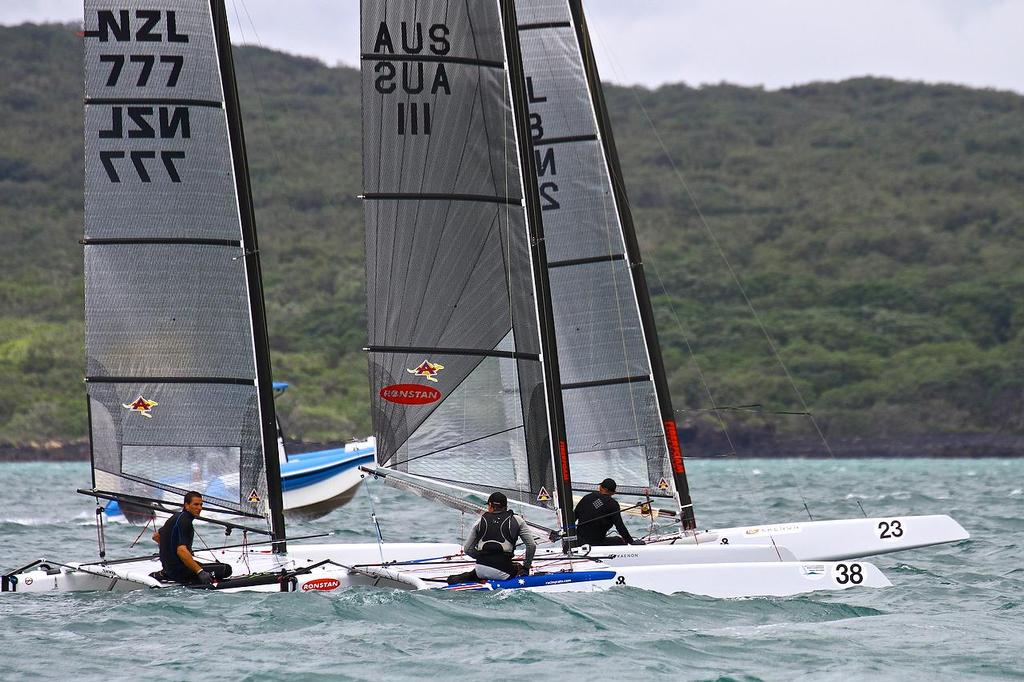 Some of the Emirates Team NZ sailors gather for a chat between races A-class catamaran World Championships, Day 3, Takapuna February 13, 2014 photo copyright Richard Gladwell www.photosport.co.nz taken at  and featuring the  class