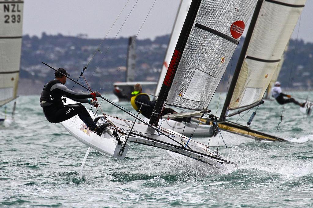 Nathan Outteridge (AUS) making a brave effort to complete the course with just one rudder. A-class catamaran World Championships, Day 3, Takapuna February 13, 2014 photo copyright Richard Gladwell www.photosport.co.nz taken at  and featuring the  class