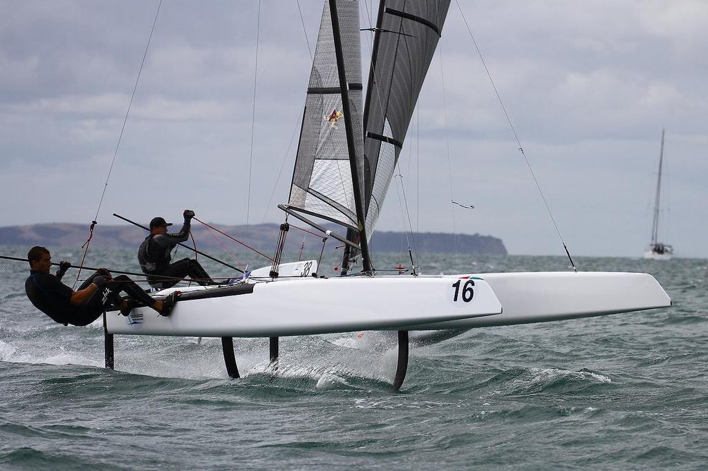 Blair Tuke (NZL)  (to windward) and Glenn Ashby (AUS)A-class catamaran World Championships, Day 3, Takapuna February 13, 2014 © Richard Gladwell www.photosport.co.nz