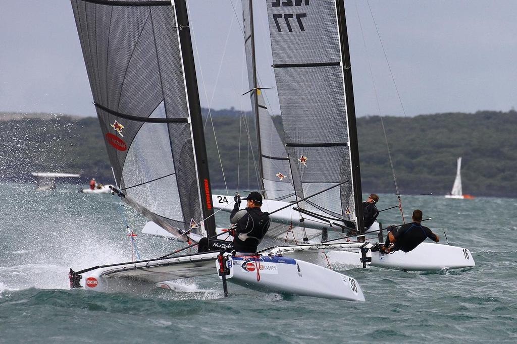 Glenn Ashby (AUS) chasing Blair Tuke (NZL) with Peter Burling (24) still on the previous leg) A-class catamaran World Championships, Day 3, Takapuna February 13, 2014 photo copyright Richard Gladwell www.photosport.co.nz taken at  and featuring the  class