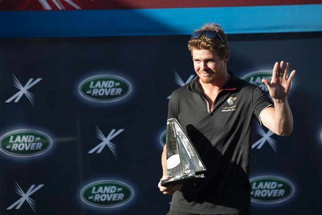 Olympic Gold Medallist Tom Slingsby with his Land Rover Above and Beyond Award presented in recognition of the greatest tactical performance and improvement seen this year on a debut appearance at the Extreme Sailing Series™. © Lloyd Images
