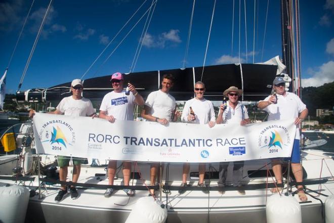 Safely on the dock in Port Louis, a happy crew on Nigel Passmore's Apollo 7 - RORC Transatlantic Race 2014.   © RORC/Arthur Daniel and Orlando K Romain