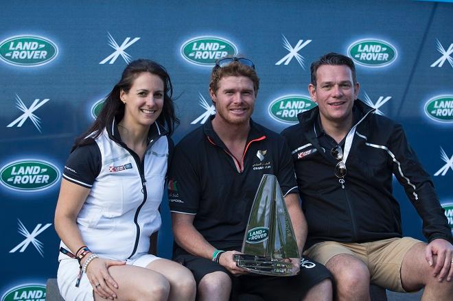 Land Rover Global Brand Ambassador, Hannah White (left) and Mark Cameron, Land Rover Global Brand Experience Director, Mark Cameron (right) with Tom Slingsby (centre), Oman Air Skipper and winner of the Land Rover Above and Beyond Award - Act Eight Extreme Sailing Series 2014. © Lloyd Images