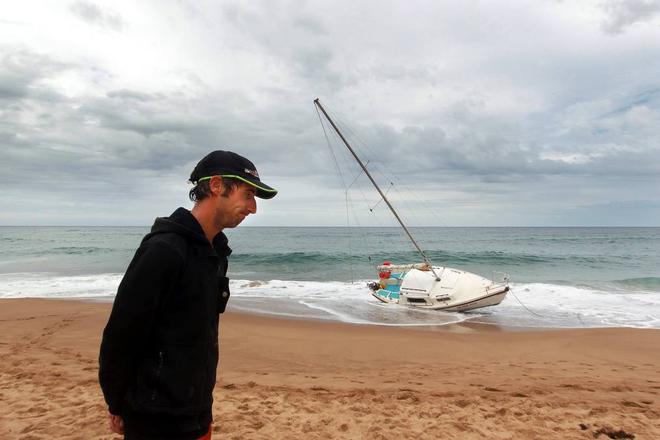 Damien Smith, owner of the yacht, at Stanwell Park Beach on Sunday. © Sylvia Liber