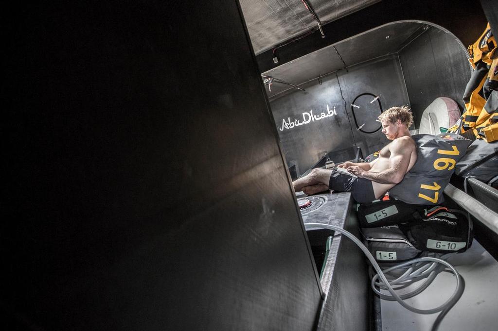 November 28, 2014. Leg 2 onboard Abu Dhabi Ocean Racing. Luke Parkinson spends his off-watch keeping weight in the bow as 
