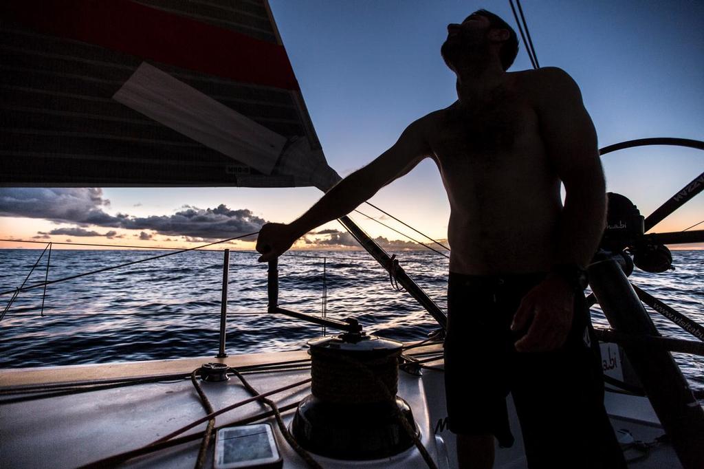 November 19, 2014. Leg 2 onboard Abu Dhabi Ocean Racing. Daryl Wislang silhouette during sunset. © Matt Knighton/Abu Dhabi Ocean Racing