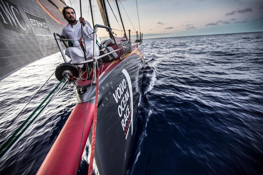 November 19, 2014. Leg 2 onboard Abu Dhabi Ocean Racing. Adil Khalid shows the crew how to dress for the heat en route to his home in Abu Dhabi © Matt Knighton/Abu Dhabi Ocean Racing