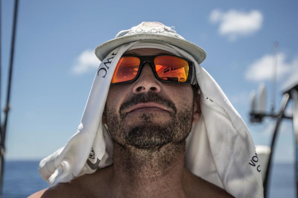 December 3, 2014. Leg 2 onboard Abu Dhabi Ocean Racing. Roberto Bermudez de Castro 'Chuny' shields himself from the hot sun © Matt Knighton/Abu Dhabi Ocean Racing