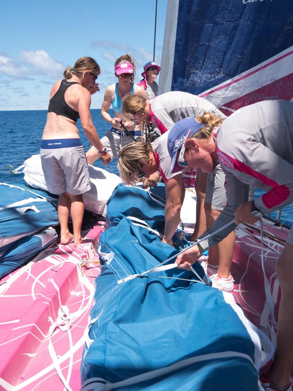 December 04, 2014. Leg 2 onboard Team SCA.The girls pack away the A3 on the foredeck. photo copyright Corinna Halloran / Team SCA taken at  and featuring the  class