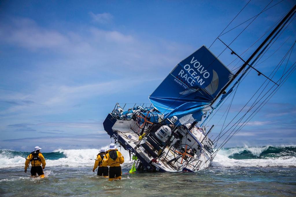 Team Vestas Wind aground the boat on Cargados Carajos Shoals. The heavy breaking surf is clearly visble in the background © Brian Carlin - Team Vestas Wind