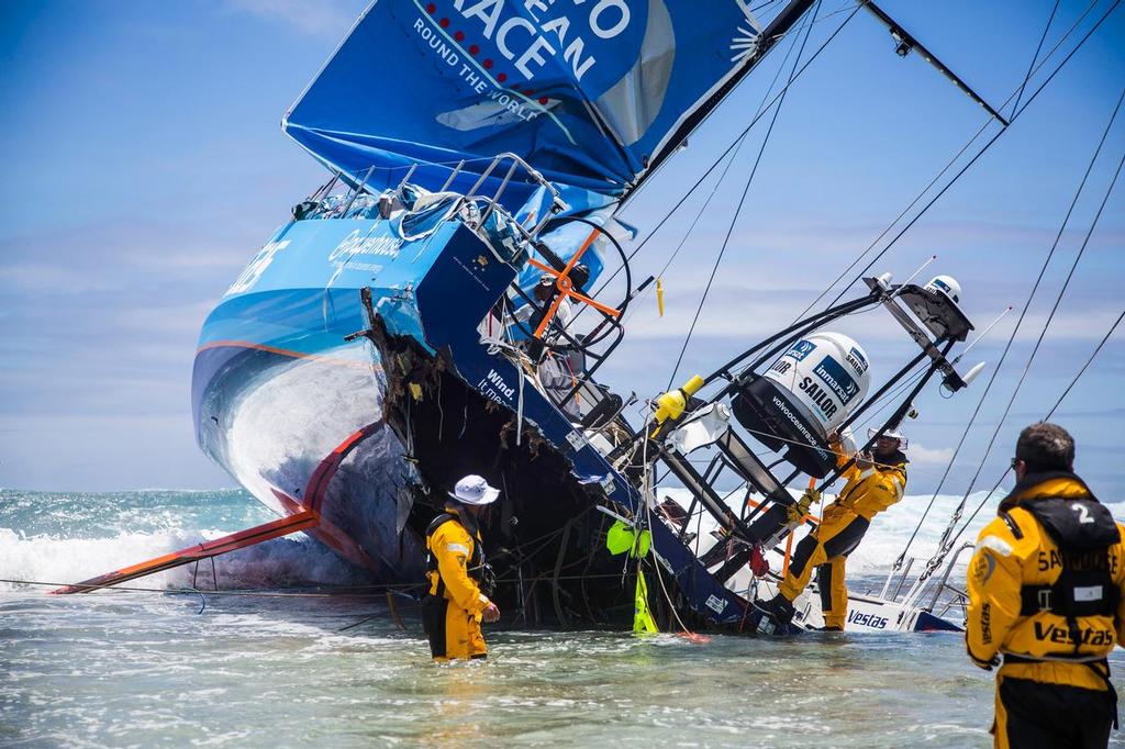 November 30, 2014. Team Vestas Wind on the Cargados Carajos Shoals as the crew remove gear. The stern section damage is evident © Brian Carlin - Team Vestas Wind