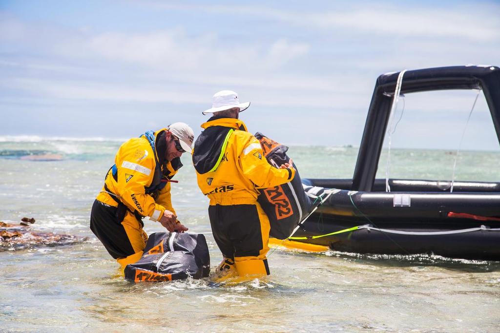 Team Vestas Wind aground on Cargados Carajos Shoals. Unloading at low tide and into the liferaft © Brian Carlin - Team Vestas Wind