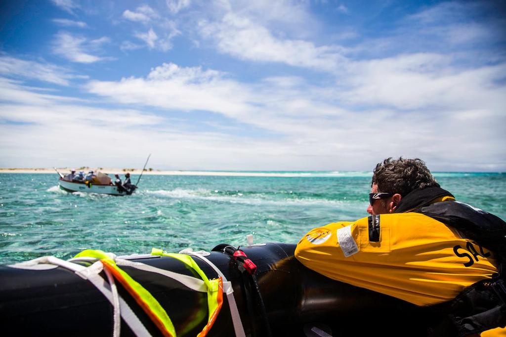 Team Vestas Wind aground on Cargados Carajos Shoals. Unloading at low tide and into the liferaft and having a think on the way back to the beach. © Brian Carlin - Team Vestas Wind