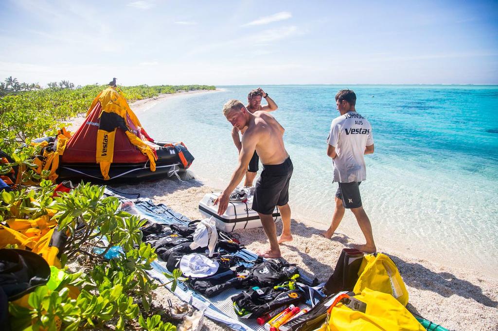 November 30, 2014. Team Vestas Wind’s boat grounded on the Cargados Carajos Shoals, Mauritius, in the Indian Ocean. Fortunately, no one has been injured. In this image, the crew lay their life jackets and other belongings on the beach to dry. © Brian Carlin - Team Vestas Wind