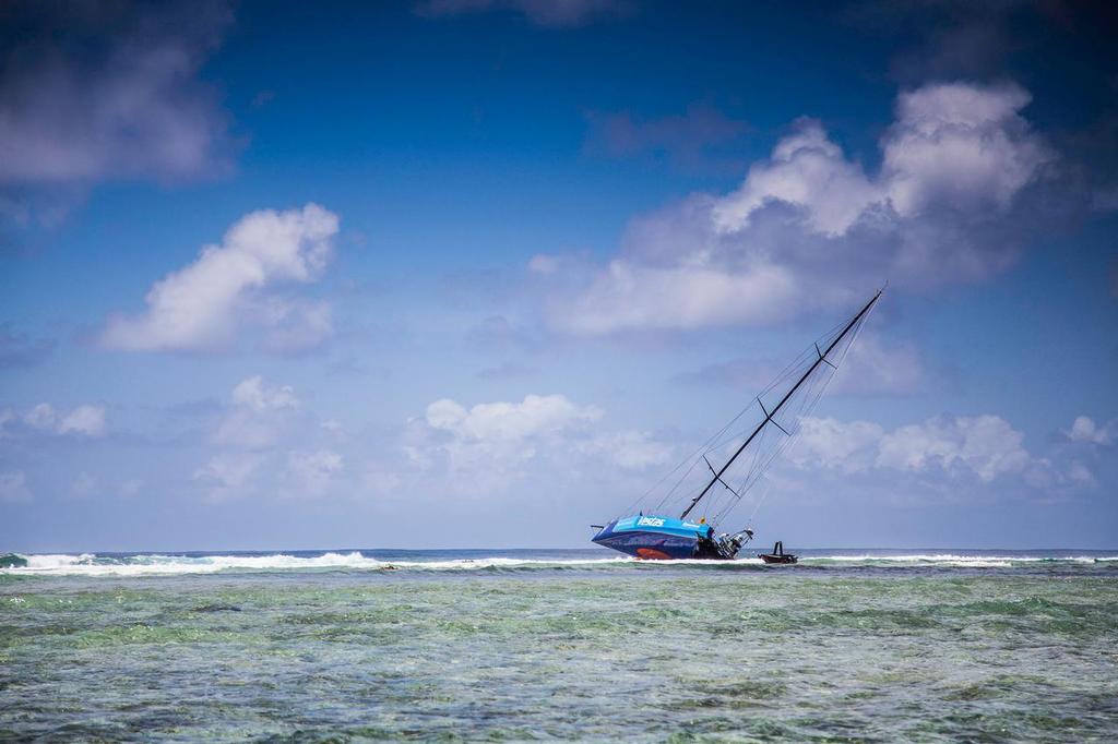 December 1, 2014. Team Vestas Wind ground the boat on Cargados Carajos Shoals. The breaking surf on the reef is in the background, the lagoon in the foreground with the yacht in the rocky reef in between © Brian Carlin - Team Vestas Wind