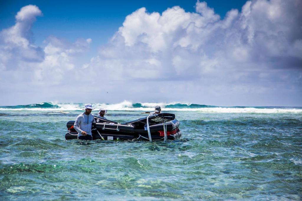 Team Vestas Wind aground on Cargados Carajos Shoals. Unloading at low tide and into the liferaft © Brian Carlin - Team Vestas Wind