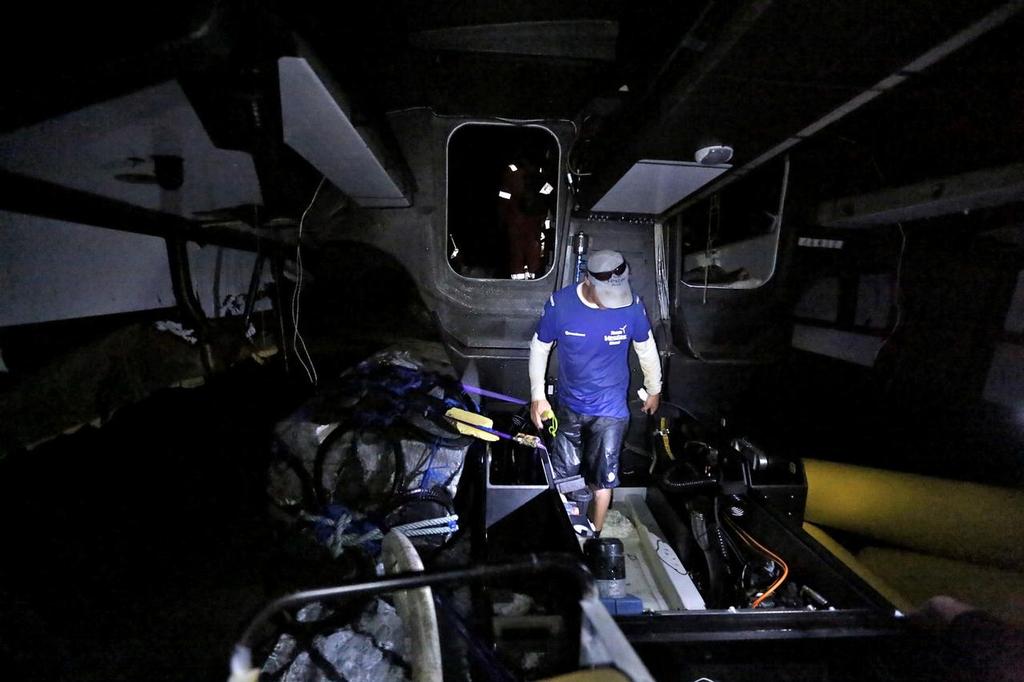 December 19, 2014. Neil Cox inside the boat at the beginning of the Team Vestas Wind salvage operation. photo copyright Shane Smart/Volvo Ocean Race http://www.volvooceanrace.com taken at  and featuring the  class