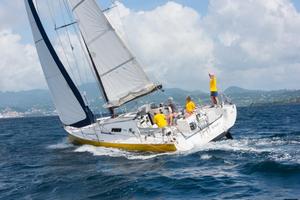 Yves and Isabelle Haudiquet's French Pogo 40, Bingo crosses the finish line in Grenada - RORC Transatlantic Race 2014. photo copyright RORC/Arthur Daniel and Orlando K Romain taken at  and featuring the  class