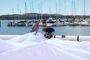 Crew packing sails at the Tamar Yacht Club at Beauty Point -  Launceston to Hobart Race 2014. photo copyright Dane Lojek taken at  and featuring the  class