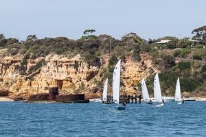 The hulk of Cerberus with the fleet departing the BRYC for the racecourse. - 2014 OK World Championships photo copyright  Alex McKinnon Photography http://www.alexmckinnonphotography.com taken at  and featuring the  class