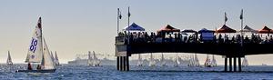 Spectators on Belmont Veterans Memorial Pier enjoy front-row seats for the Rose Bowl Regatta photo copyright Rich Roberts taken at  and featuring the  class