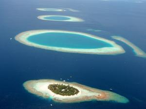 Coral islands in Maldives. Consisting of 1,192 tiny coral islands scattered some 800 kilometers across the equator, Maldives has long been known as a paradise for holiday makers.   --- Image by © Liu Yongqiu/Xinhua Press/Corbis photo copyright  SW taken at  and featuring the  class