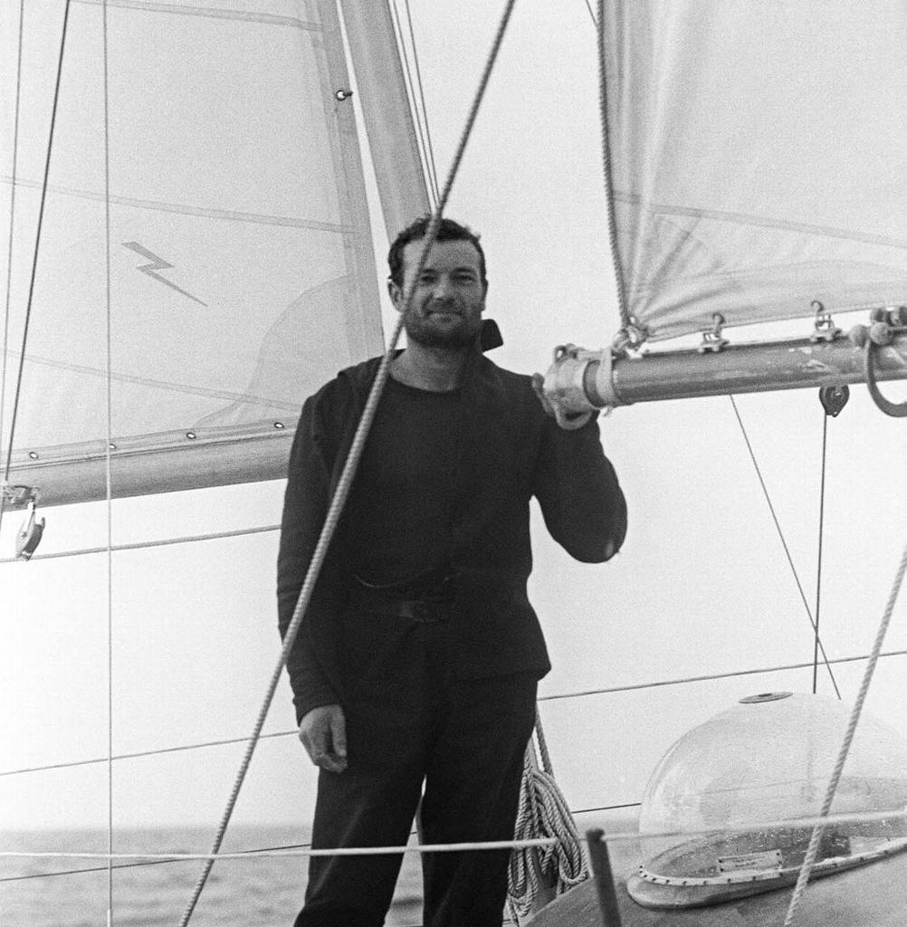 French sailor Eric Tabarly stands on the deck of Pen Duick II as he crosses the finish line in Newport, Rhode Island, 18 June 1964 to win the transatlantic race betwen Plymouth and Newport. photo copyright AFP taken at  and featuring the  class