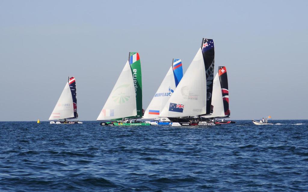 Emirates Team New Zealand leads the fleet sailing on Day 1 of the Extreme Sailing Series Act 2 in Muscat, Oman. photo copyright Emirates Team New Zealand http://www.etnzblog.com taken at  and featuring the  class