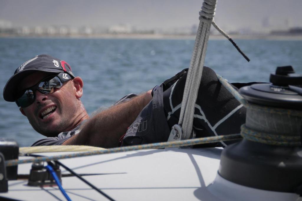 James Dagg hiking out onboard Emirates Team New Zealand sailing on Day 4 of the Extreme Sailing Series Act 2 in Muscat, Oman. &copy; Hamish Hooper/Emirates Team NZ http://www.etnzblog.com