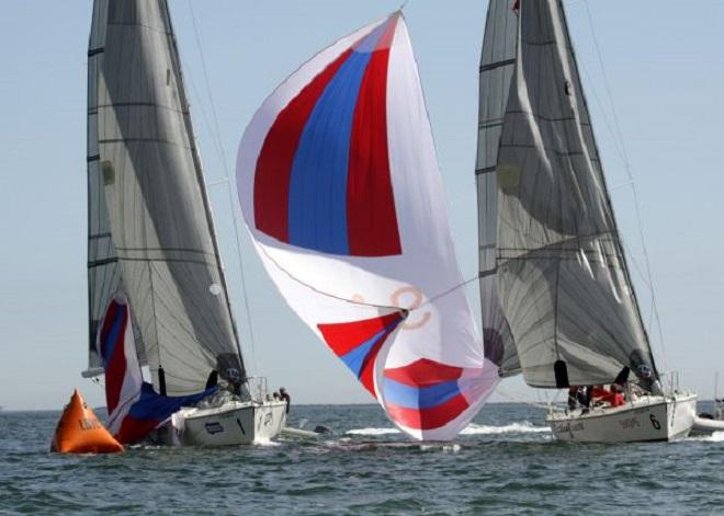 Phil Robertson’s chute flies fast and loose at Dustin Durant (l.)  - Congressional Cup 2014 © Rich Roberts