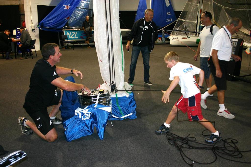 YNZ RSO, Hamish Hey helps out with the North Sails and Harken NZ hoisting game - 2013 Hutchwilco New Zealand Boat Show - on next month © Miranda Powrie