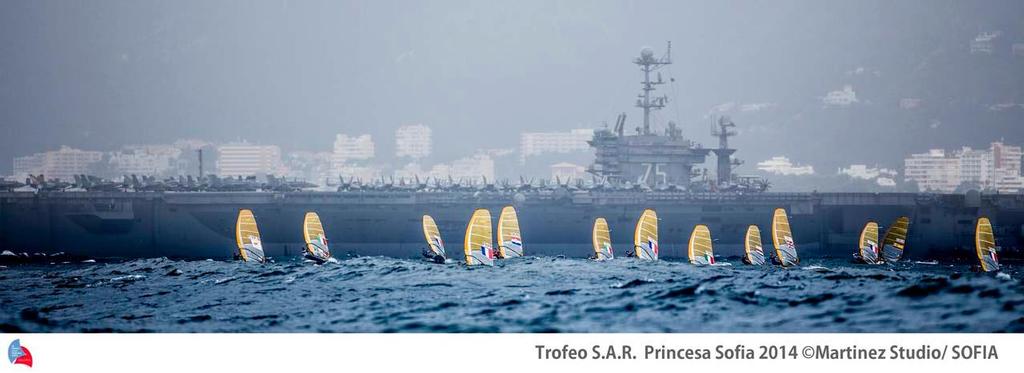 US military air carrier Harry S. Truman and the RS:X fleet - ISAF Sailing World Cup Mallorca day 4 photo copyright  Martinez Studio / Sofia http://www.trofeoprincesasofia.org/ taken at  and featuring the  class