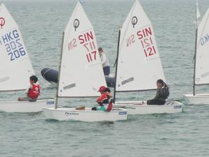 Singapore's Optimist sailors won Silver in the Team Racing Event photo copyright SingaporeSailing taken at  and featuring the  class