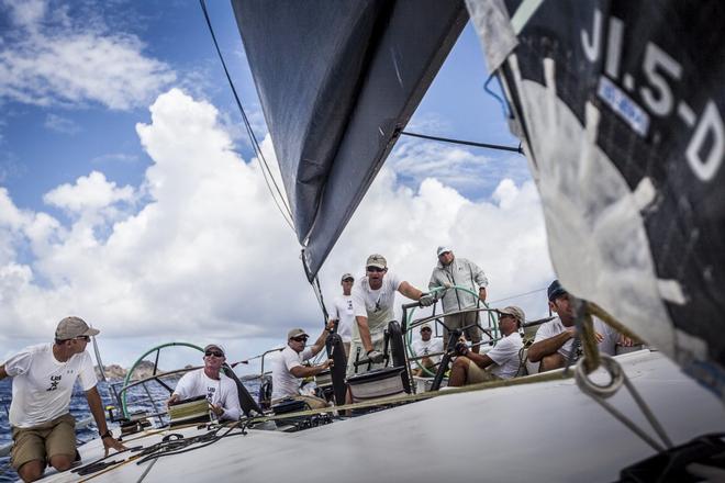 Hap Fauth helms his ’Bella Mente’ upwind in light air during the second day of racing at Les Voiles de St. Barth. © Peter Duross
