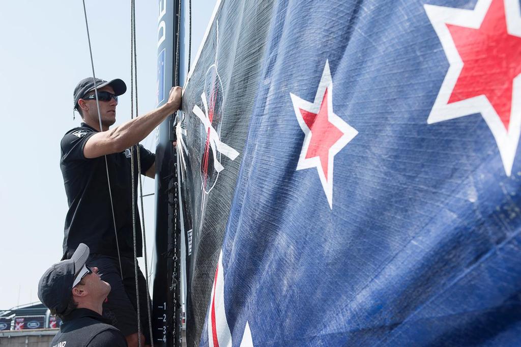 Emirates Team New Zealand sailor Blair Tuke helps with raising the main on the practice day of the Land Rover Extreme Saling Series regatta in Qingdao China. 30/4/2014 © Chris Cameron/ETNZ http://www.chriscameron.co.nz