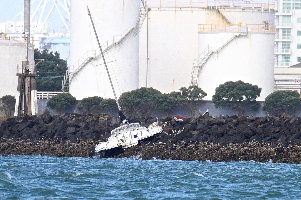 Damaged trimaran, Auckland’s Westhaven sea wall April 16, 2014 © Richard Gladwell www.photosport.co.nz