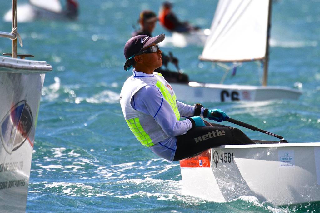 Scott McKenzie crosses the finish line  - Day 5, 2014 Toyota Optimist Championships, Manly SC photo copyright Richard Gladwell www.photosport.co.nz taken at  and featuring the  class