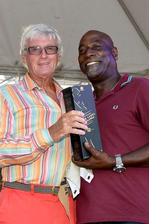 Two veteran sporting icons from Antigua: Sir Viv Richards presents Biwi Magic owner, Geoffrey Pidduck with  Johnnie Walker prizes for first place on the Johnnie Walker Race Day 2 at Antigua Sailing Week - Antigua Sailing Week photo copyright Ted Martin taken at  and featuring the  class