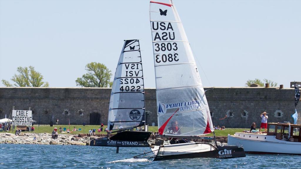 Anthony Kotoun (background) and Brooks Reed cross tacks while picnickers at Fort Adams look on.  Newport, RI.2014 © Meredith Block/US Moth Class photo copyright SW taken at  and featuring the  class