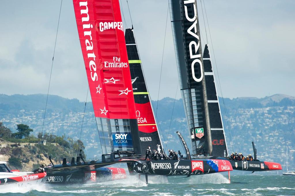 Emirates Team New Zealand follows Oracle Team USA around the first mark in race five on day three of the America's Cup 34.  San Francisco. 10/9/2013 © Chris Cameron/ETNZ http://www.chriscameron.co.nz