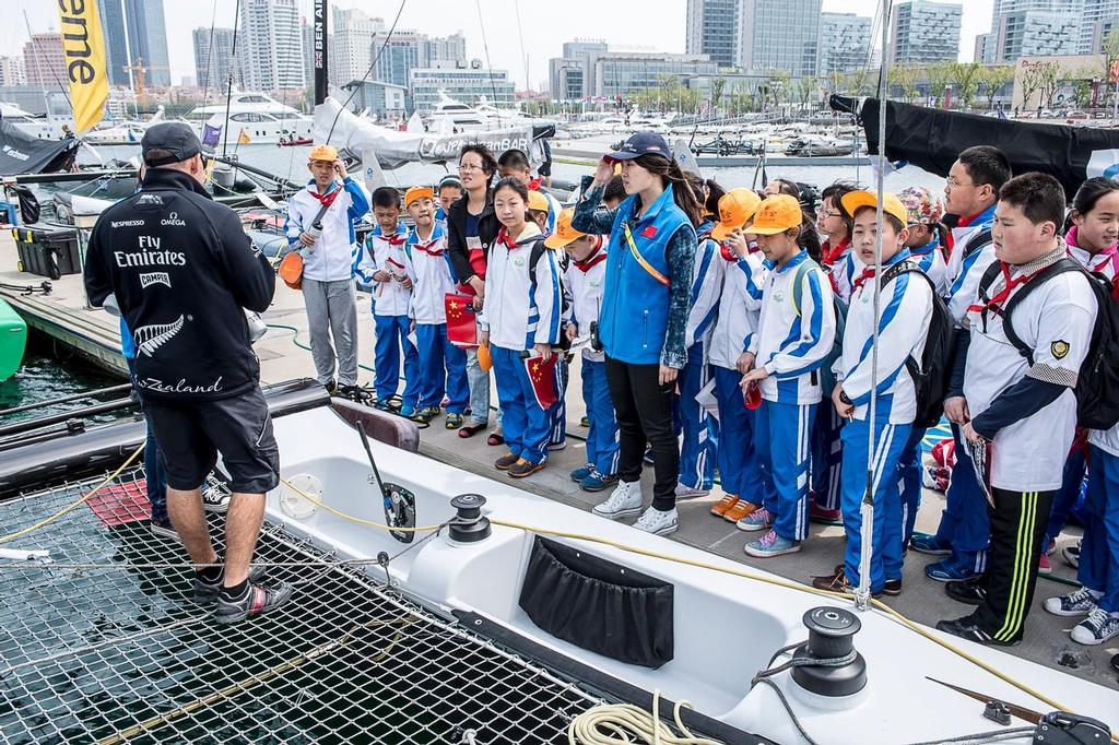 Emirates Team New Zealand’s Ray Davies shows local school children over the team’s Extreme 40. Day four of the Land Rover Extreme Sailing Series regatta in Qingdao, China. 4/5/2014 &copy; Chris Cameron/ETNZ http://www.chriscameron.co.nz