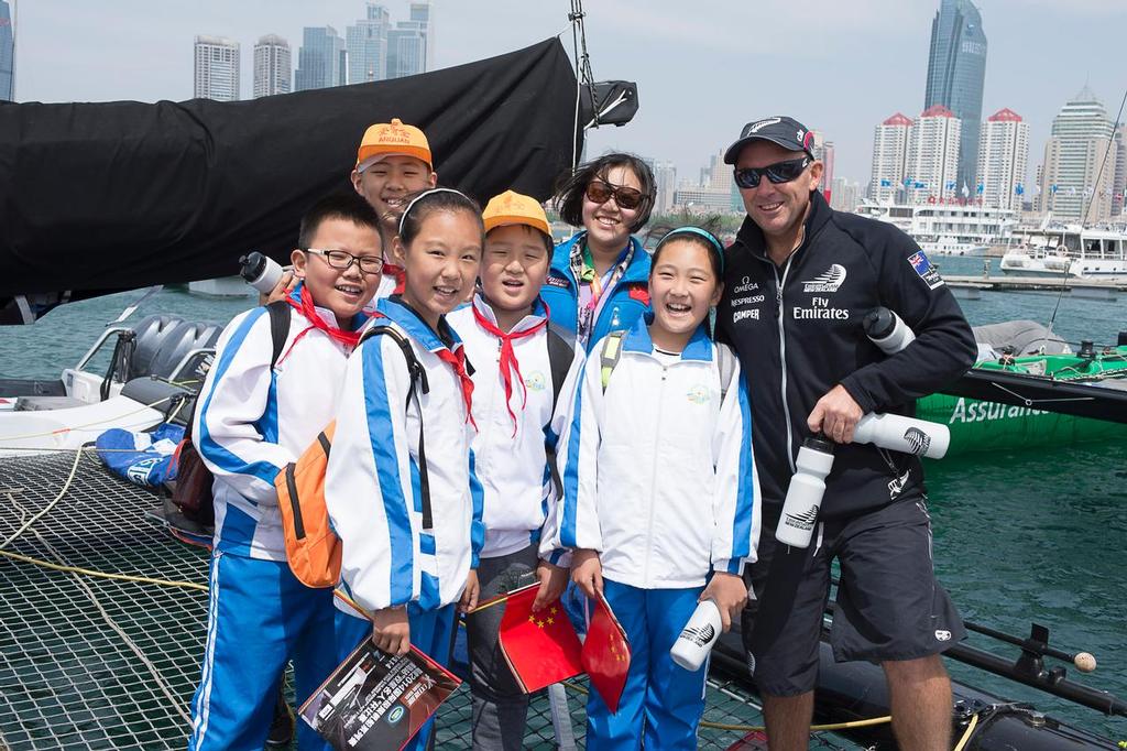 Emirates Team New Zealand’s Ray Davies shows local school children over the team’s Extreme 40. Day four of the Land Rover Extreme Sailing Series regatta in Qingdao, China. 4/5/2014 &copy; Chris Cameron/ETNZ http://www.chriscameron.co.nz