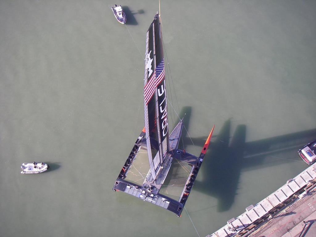 Oracle Team USA lowered into the water, showing the hull and platform proportions © Neil Wilkinson - OTUSA