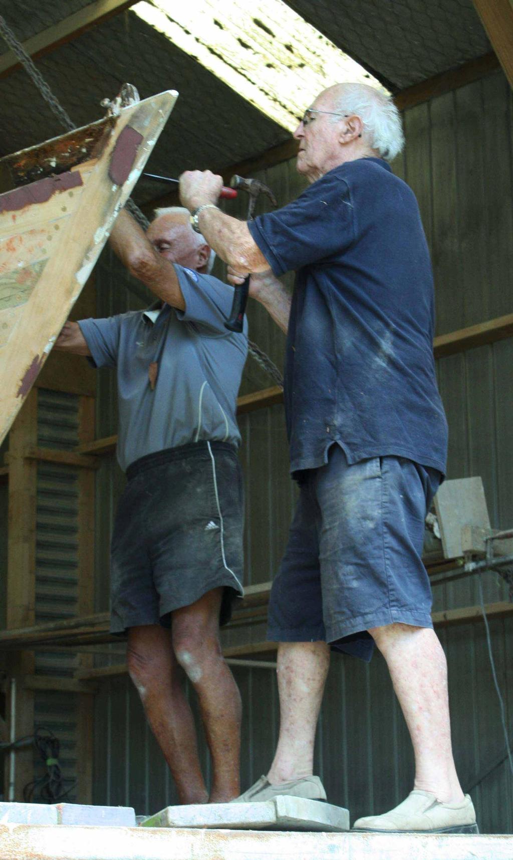 Max Carter (right) and former Rainbow II navigator Roy Dickson stripping off Rainbow II’s toe rail - May 2014 photo copyright SW taken at  and featuring the  class