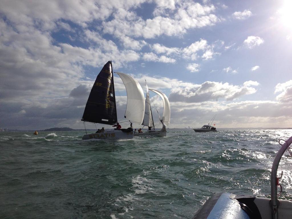 Retro (Mike Sanderson) and Shapeshifter (Brad March) in a tight tussle to the finish line - 2014 Elliott 5.9 Auckland Champs © Elliott 5.9 Association Media